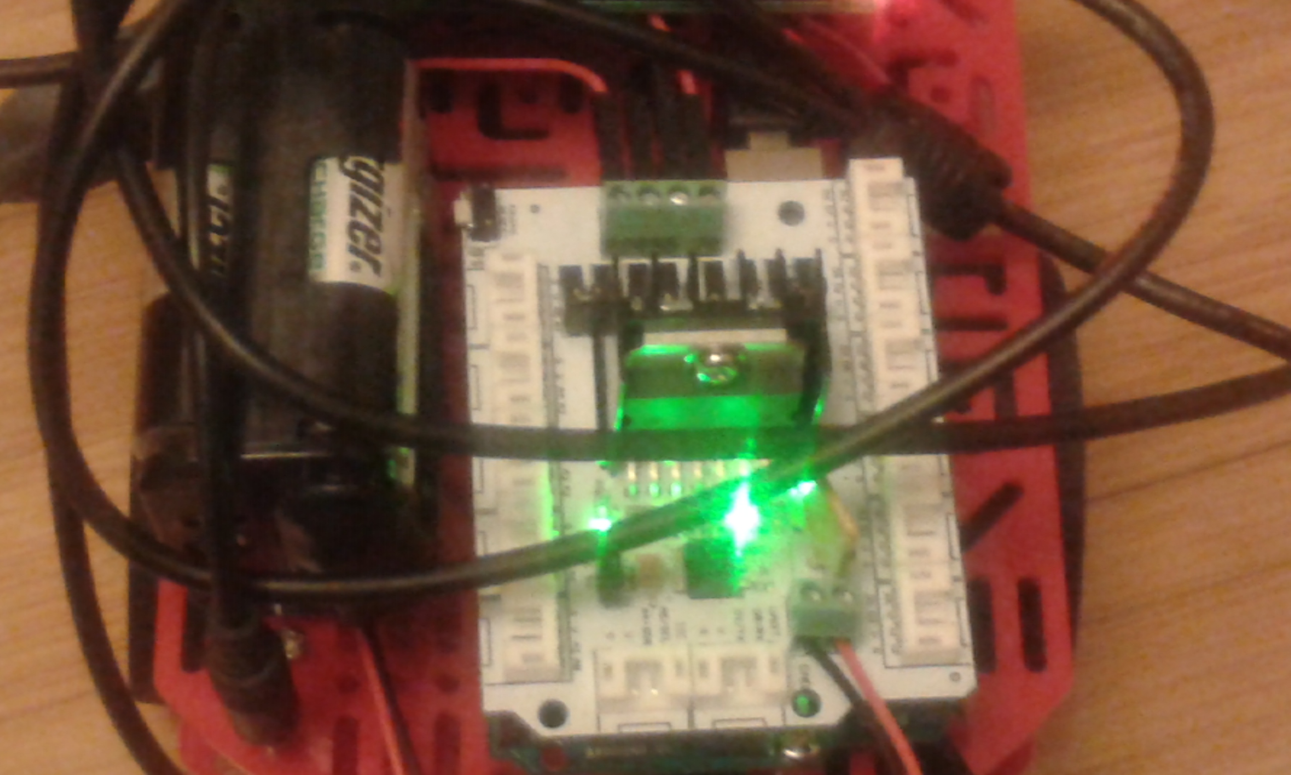 Top down view of Marco 2 showing motor shield with Arduino Uno board sitting underneath.